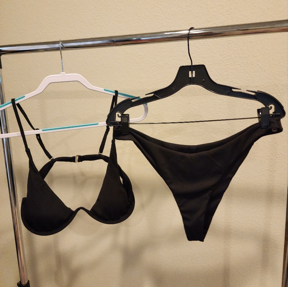 Brand new Black 2 piece bikini with wire to hold the girls up. Size XL.